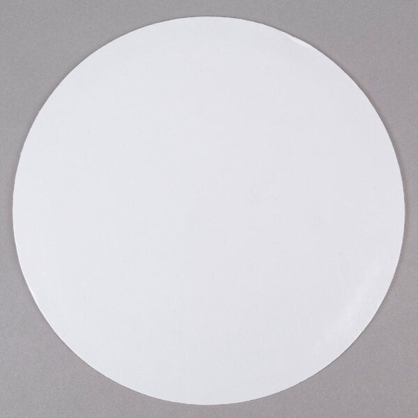 a white circle on a gray surface