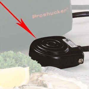 A red arrow pointing to a black Nemco foot pedal.