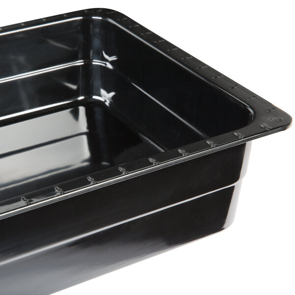 A black melamine food pan with a black rim.