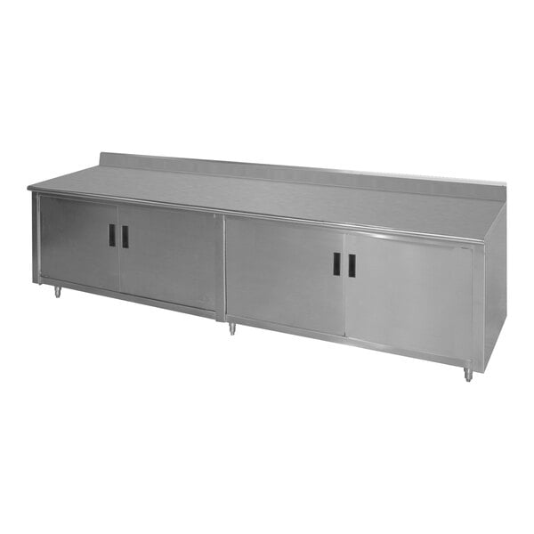 A stainless steel enclosed base work table with a fixed midshelf and backsplash.