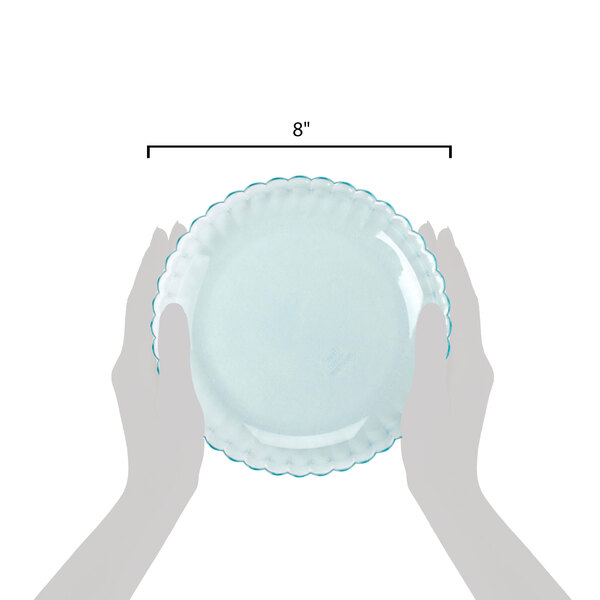 A pair of hands holding a jade polycarbonate deep plate with blue trim.