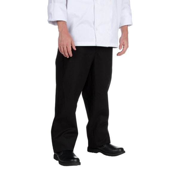 A man wearing Chef Revival black chef trousers and a white chef coat.