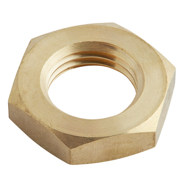 A close up of a brass hex nut.