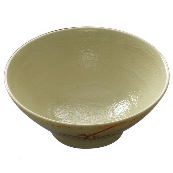 A white melamine bowl with a gold orchid design on it.