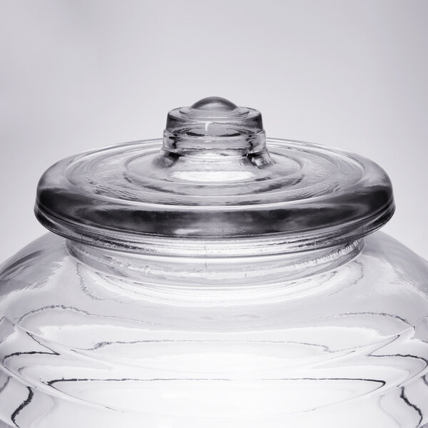 A Libbey clear glass barrel jar with a lid.