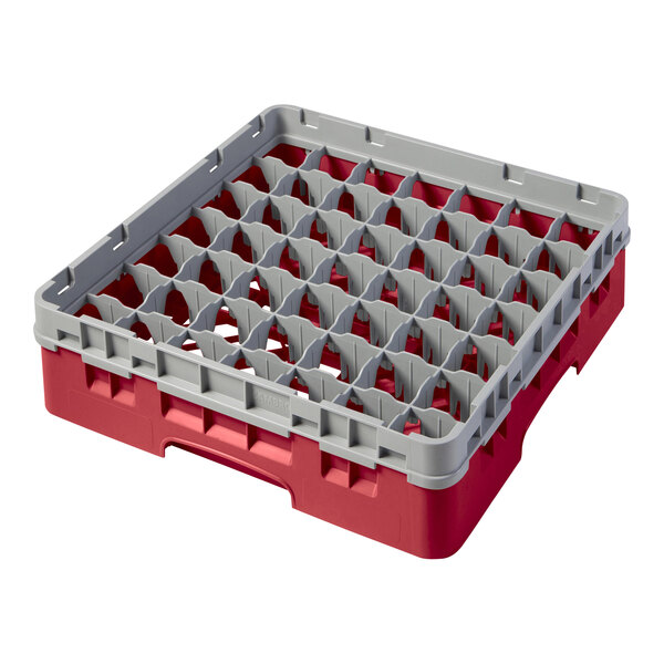 A red and grey plastic Cambro glass rack with several compartments.