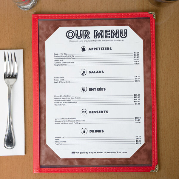 Burgundy menu paper with a marble border on a table.