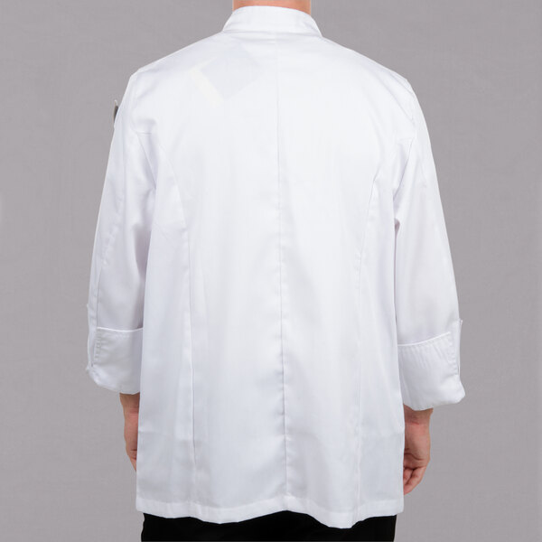 A person wearing a white Chef Revival chef coat.