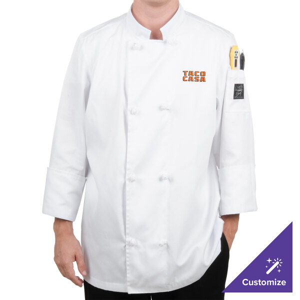 A person wearing a white Chef Revival chef coat with a logo on the left chest.