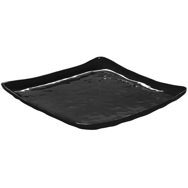 A black square serving platter with a wavy edge.