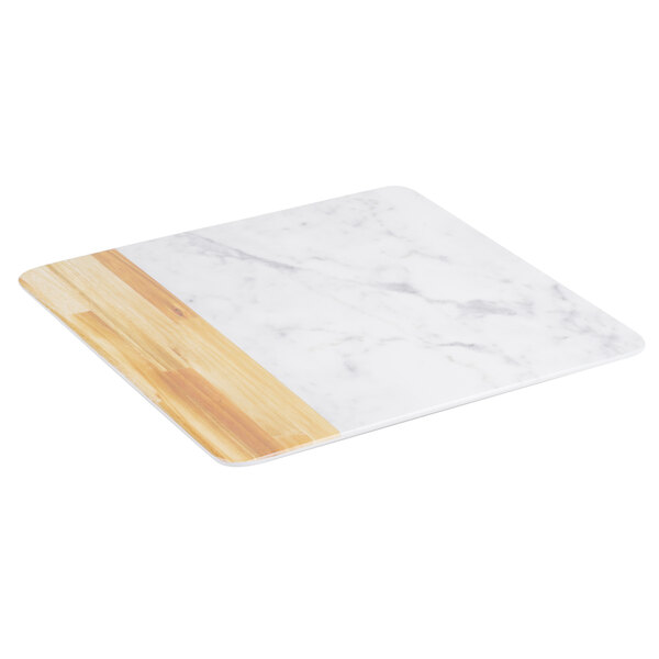 An Elite Global Solutions M13M Sierra faux alder wood and Carrara marble serving board with white and wood surfaces.