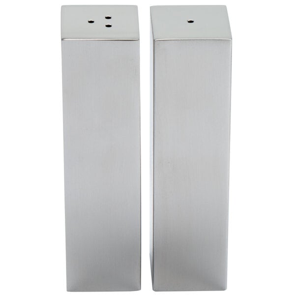 Two rectangular stainless steel salt and pepper shakers.