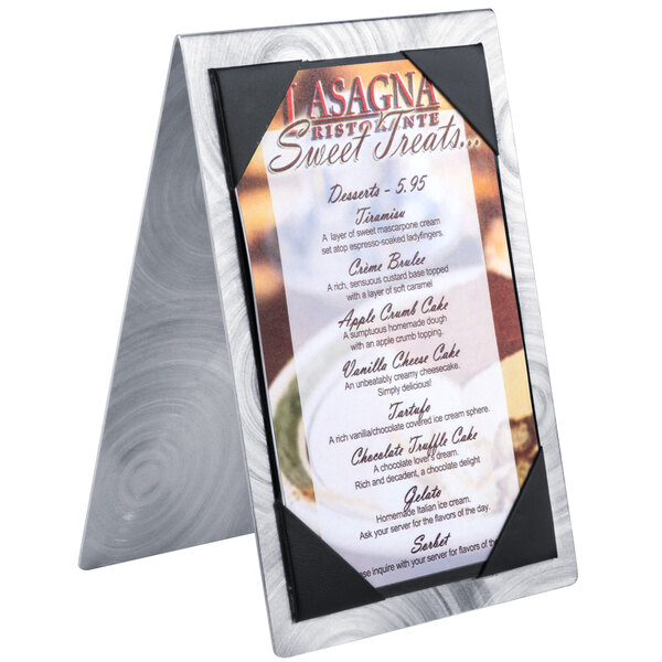 A Menu Solutions Alumitique menu tent holding a menu on a metal stand.