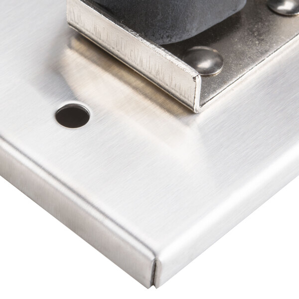 A T&S stainless steel mop hanger.