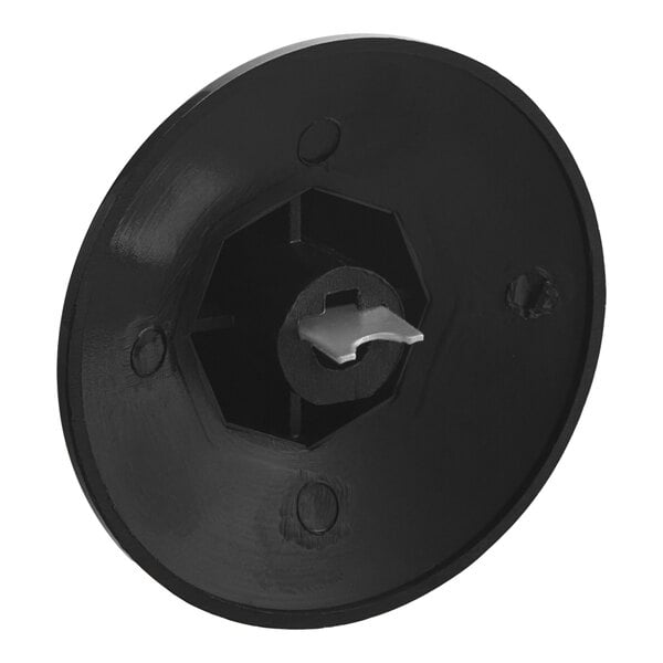 A black circular plastic thermostat knob with a white circle on it.
