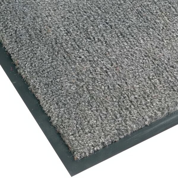 A close-up of a Notrax gunmetal carpet entrance mat with black edges.