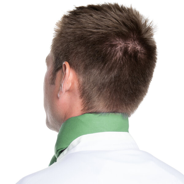 The back of a man wearing a seafoam green chef bandana.