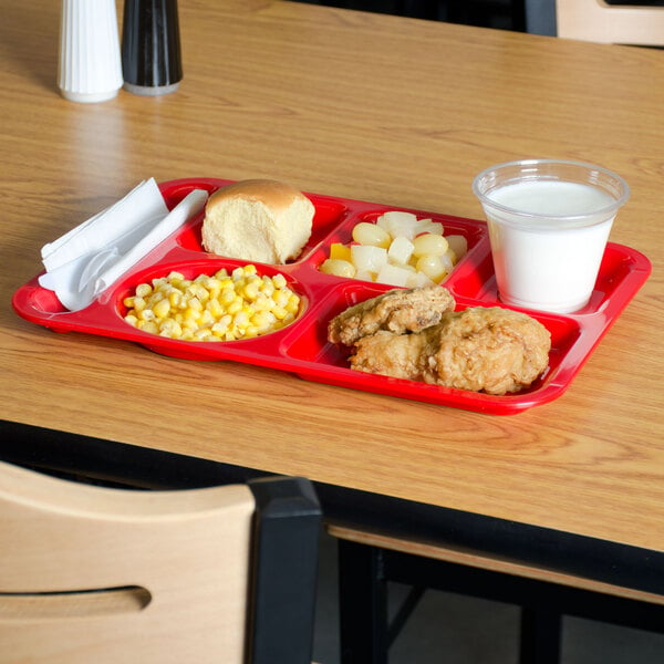 A red Carlisle compartment tray with food on it.