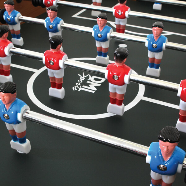 An American Legend foosball table with red and blue figurines of soccer players.