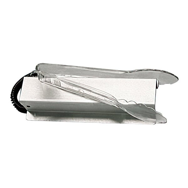 A set of clear plastic tongs resting on a rectangular metal holder.