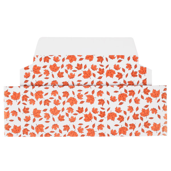 A white envelope with a pattern of orange leaves on it.