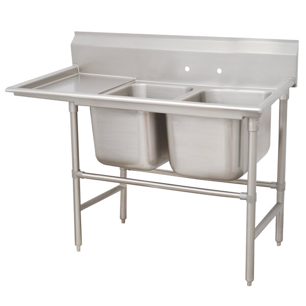 A stainless steel Advance Tabco two compartment pot sink with a left drainboard.