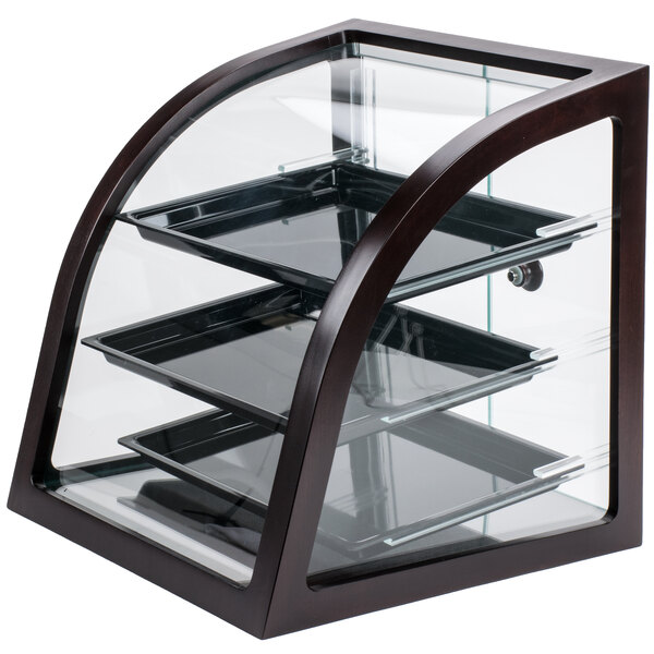 A Cal-Mil Westport wood trim bakery display case with three trays behind glass.