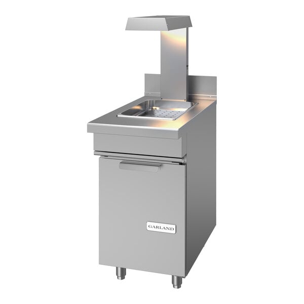 A stainless steel commercial fry holding station with a heat lamp and storage compartment.