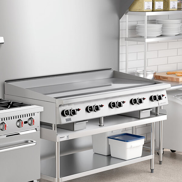 A large stainless steel 60-inch natural gas countertop griddle with multiple thermostatic controls, designed for commercial kitchen use.