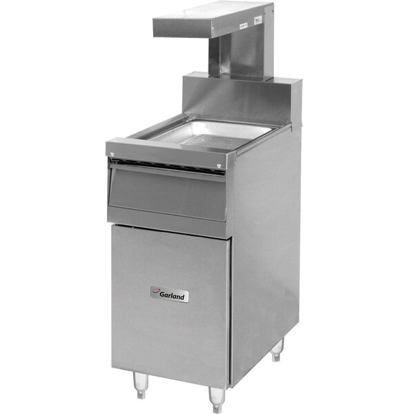 A Garland Sentry range match fry holding station with heat lamp over a drawer.