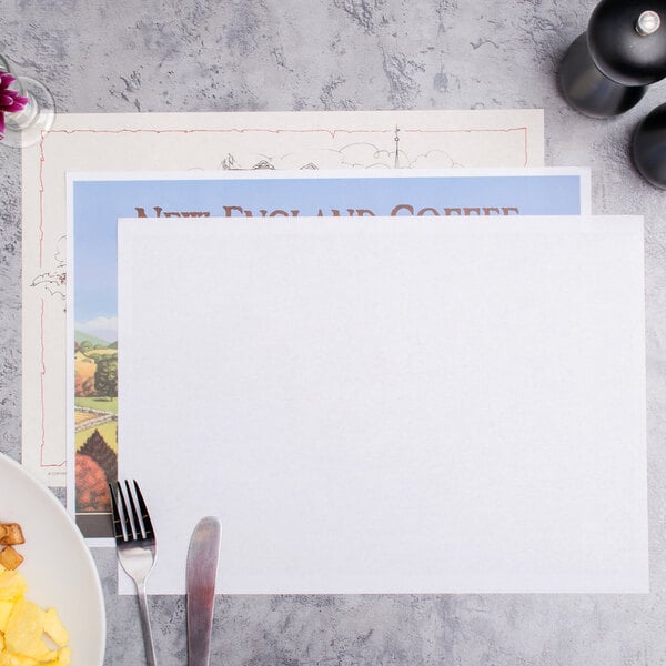 A table with a plate of food and a Choice paper placemat on it.