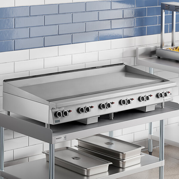 A Garland stainless steel countertop griddle with thermostatic controls.
