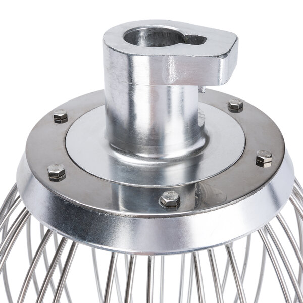 A Vollrath stainless steel wire whisk with a metal handle.