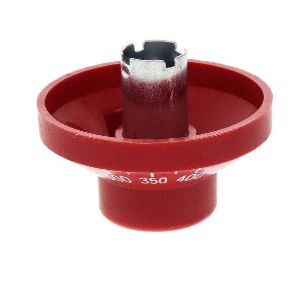 A red plastic dial with a metal cover.
