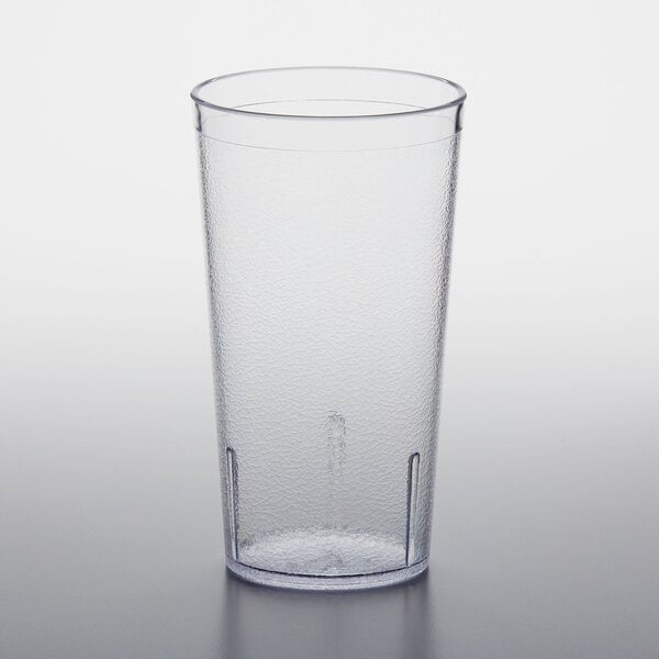 A clear plastic GET tumbler on a white surface.