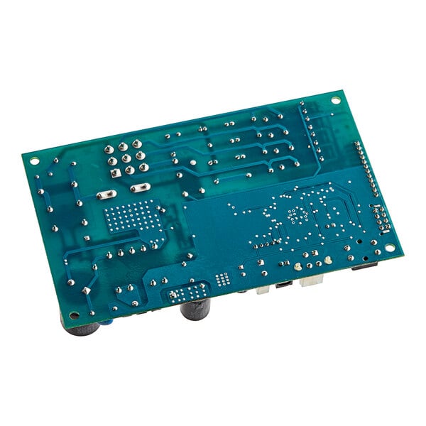 A close-up of a Manitowoc Ice control board with several blue and white components.