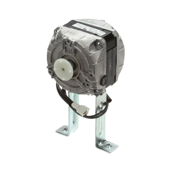 A close-up of a Grindmaster-Cecilware fan motor with a white round disc on the metal base.