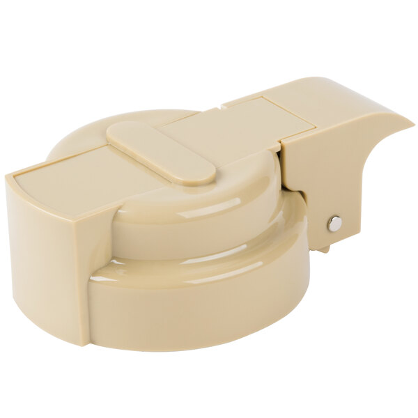 A Tablecraft beige plastic dressing top with a lid and clip.