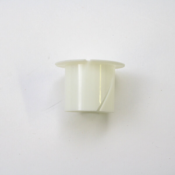 A white plastic Hobart bushing with a broken hole on top.