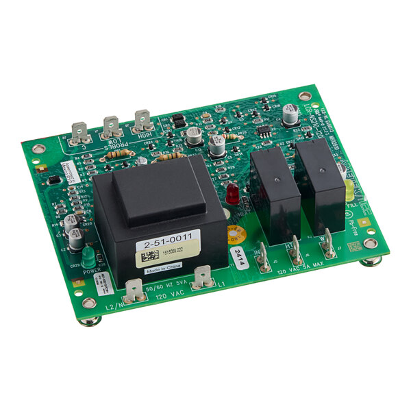 A green electronic control circuit board with various components, including relays and a transformer, used for water level control.