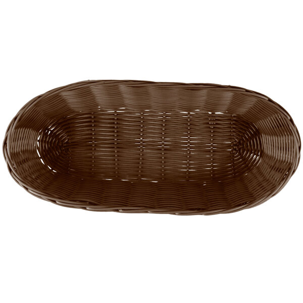 A Tablecraft brown rattan oblong bread basket with a handle.