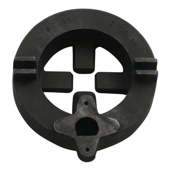 A black plastic circular burner disc with holes and a cross in the center.
