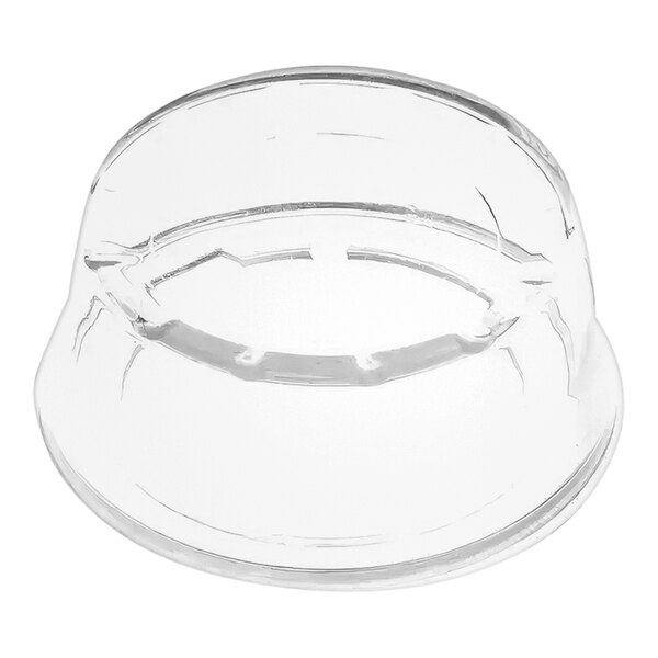 A clear rubber push button cover with a hole in the middle.