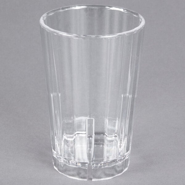 A Cambro clear polycarbonate tumbler with a straw.