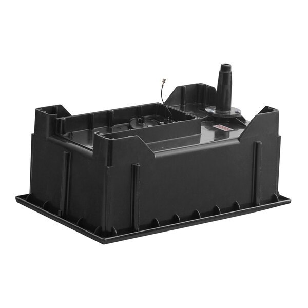 A black rectangular plastic component with raised edges, internal compartments, and a protruding cylindrical part on one side.