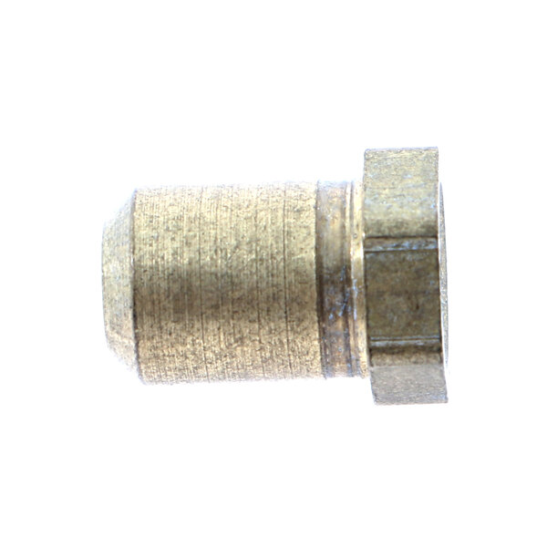 A brass threaded nut on a metal surface.