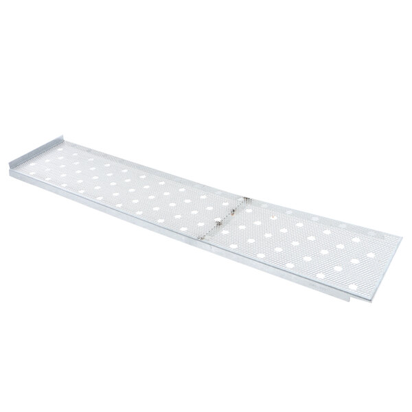 A Middleby Marshall metal plate with holes.
