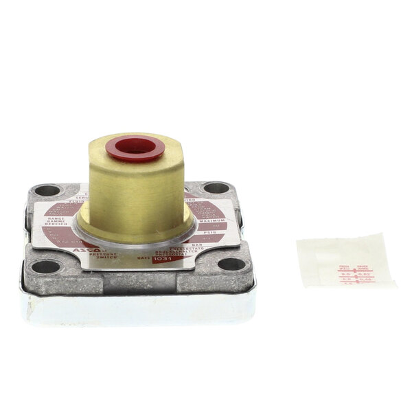 A Blodgett pressure switch assembly with a metal and red plastic valve.