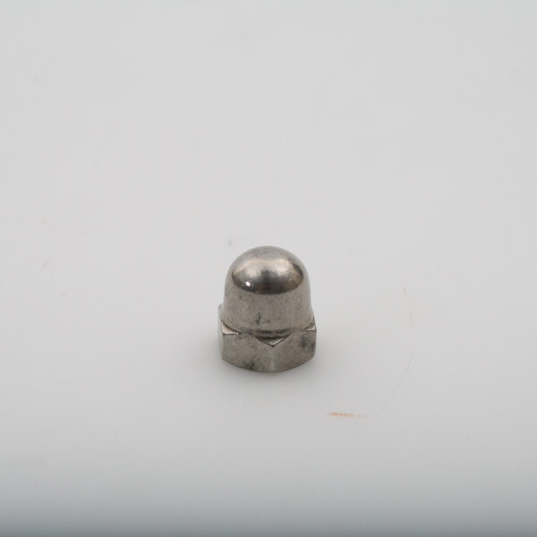 a silver object on a white surface