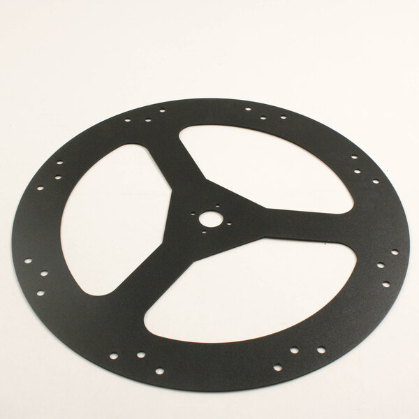 A black circular disc with holes.